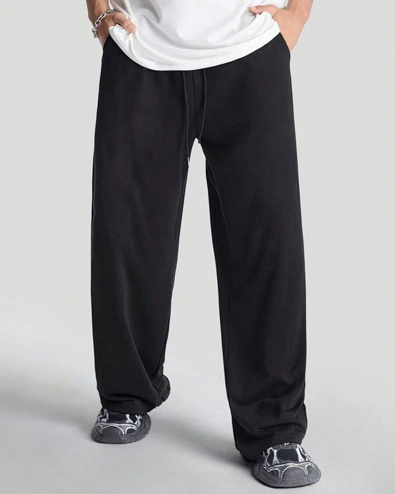 فلاينوف بنطلون رياضي رجالي أسود سادة بقصة فضفاضة - Image 1